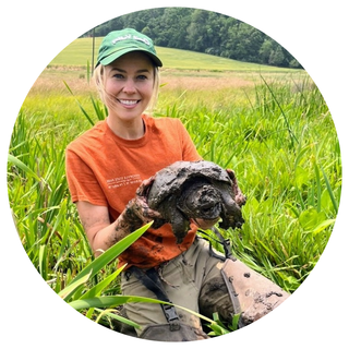 Terra Haines holding a turtle